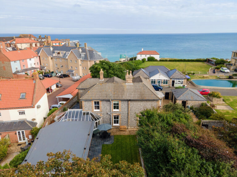 Aerial view of North Cottage Cromer showing location close to the beach and North Lodge Park