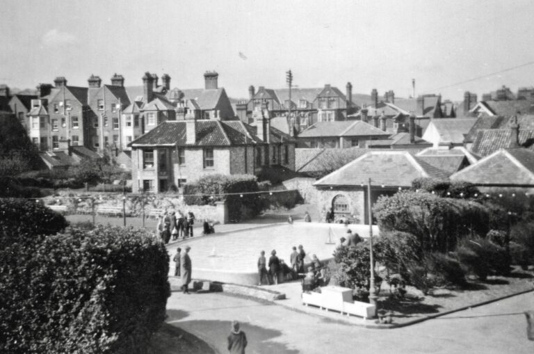 North Cottage Cromer in 1957 with the boating pond to the foreground. Black and white image.