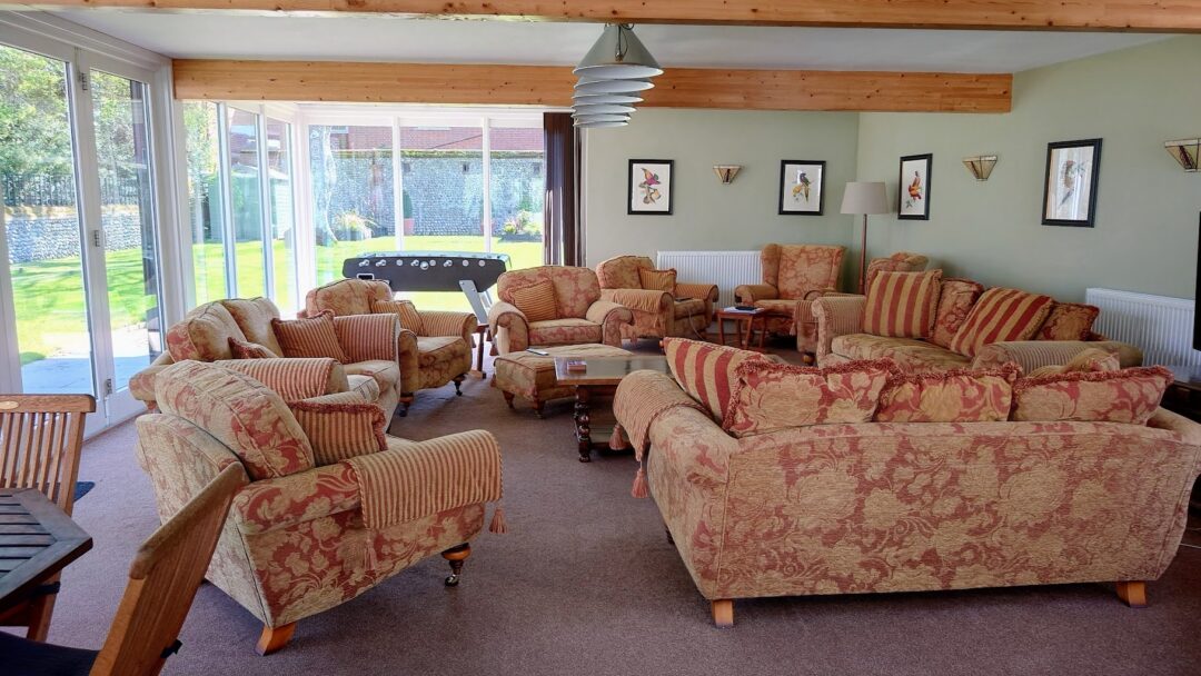 The Garden Room at North Cottage comfortably seats all 12 guests. There's a smart Sony TV, indoor and garden games and table foosball.