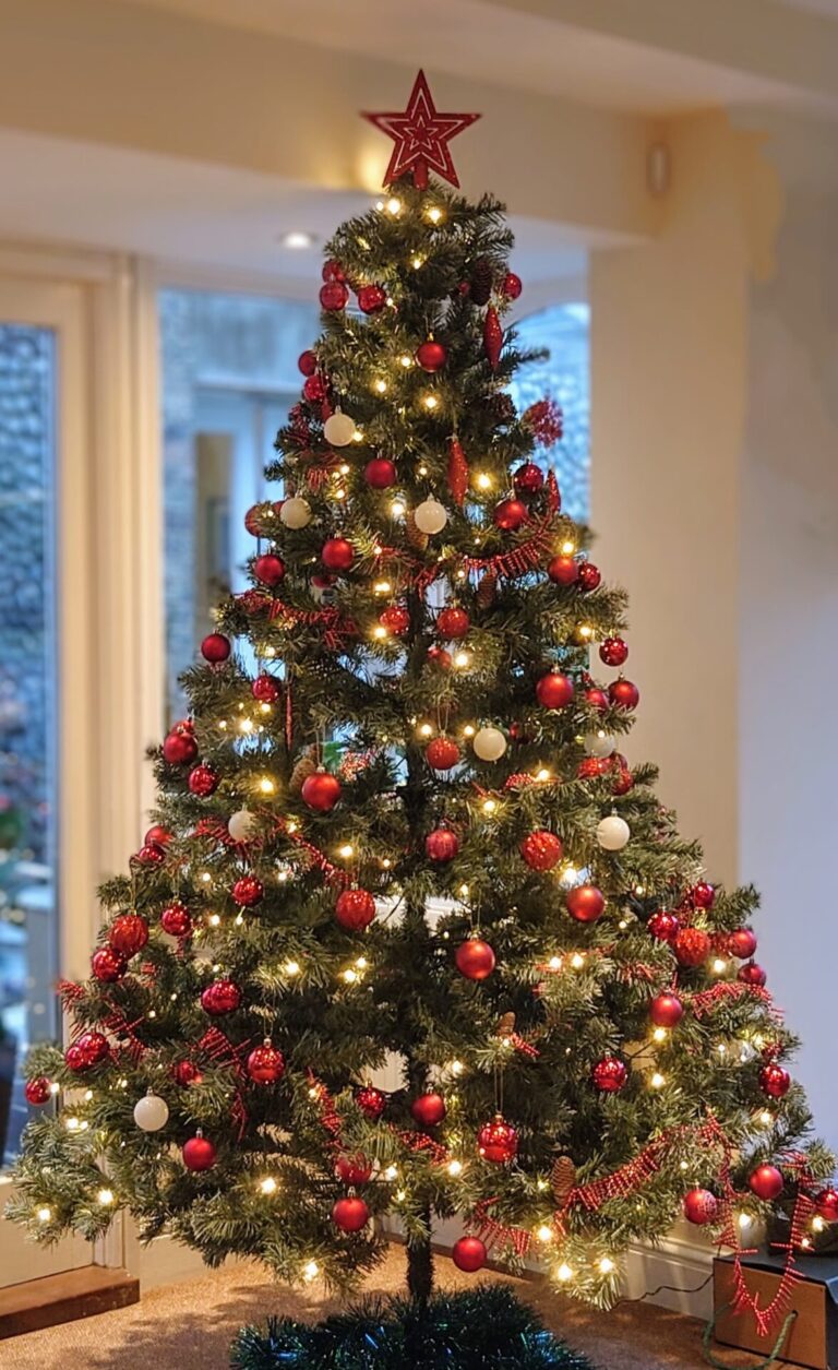 Decorated Christmas tree in the Garden Room - North Cottage Cromer