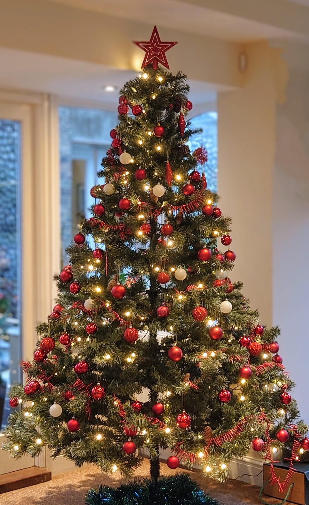 Decorated Christmas tree in the Garden Room - North Cottage Cromer
