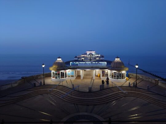Night time shot of Cromer Pier showing the lights of the Pavilion Theatre.