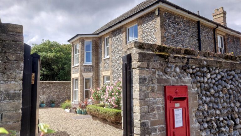 Exterior view North Cottage Cromer - award winning luxury holiday let. The building is classic Norfolk brick and flint style dating from 1873.
