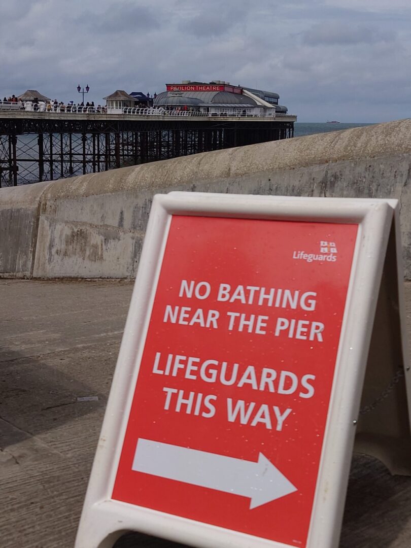 No bathing near the Pier sign photographed on Cromer promenade 2026.