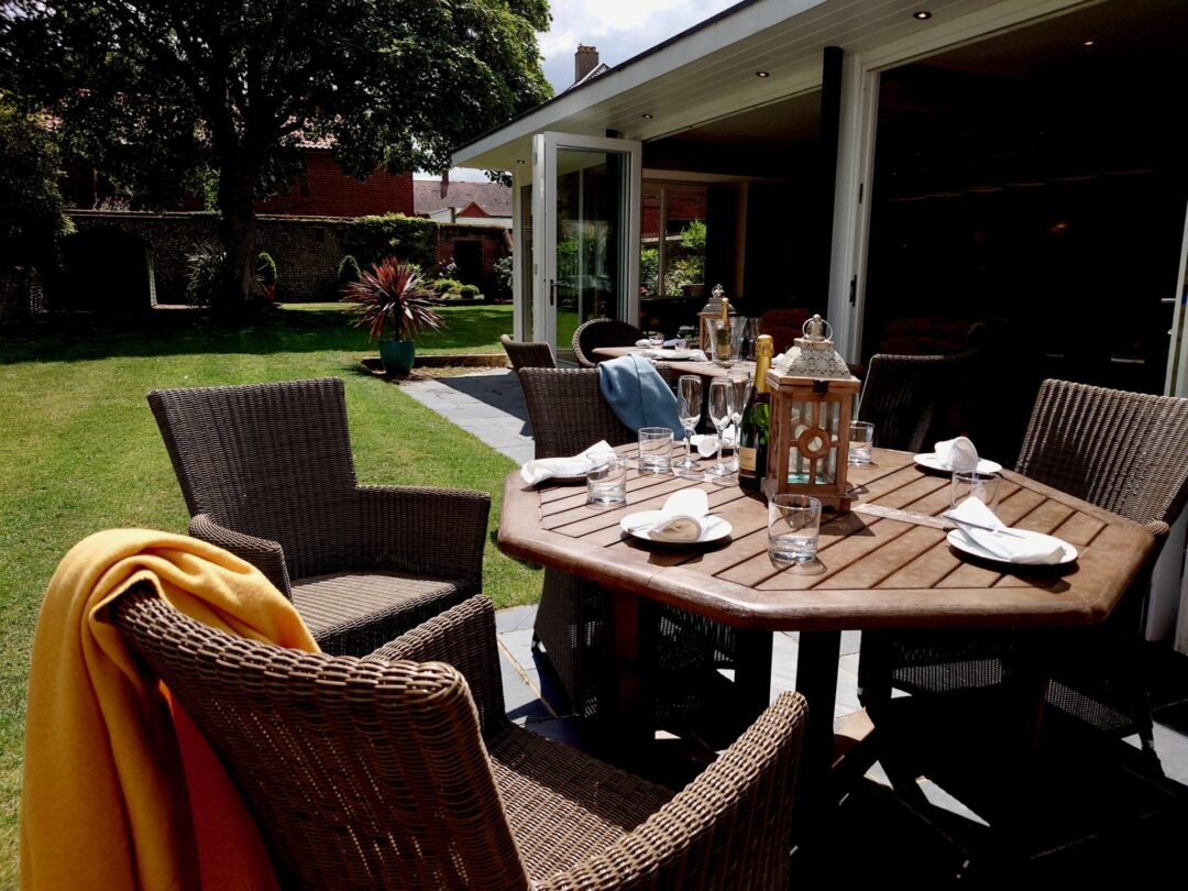 Garden dining on the terrace at North Cottage Cromer - award winning holiday cottage